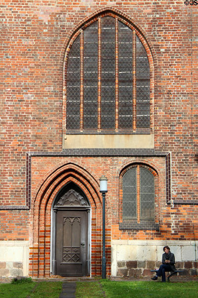 Brick Gothic entrance & windows of St Nicholas Church. Greifswald, Germany.