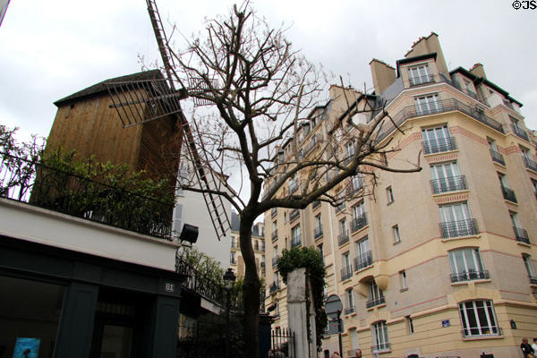 Blute-Fin Windmill home of Moulin de la Galette on Montmartre, now surrounded by apartments. Paris, France.