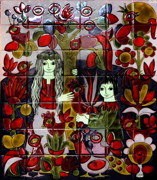 Two Breton women beside tree with birds painting on ceramic tile by Dodik Jégou. St Malo, France.