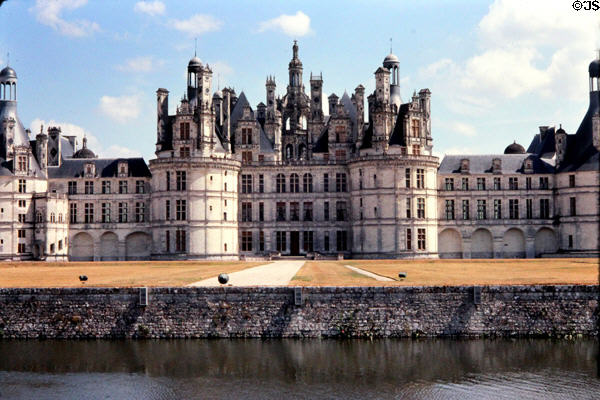 Front facade of Chambord Chateau seen across moat. Chambord, France.