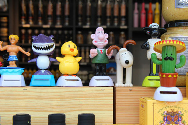 Bobble heads in shop window on Place St Croix. France.