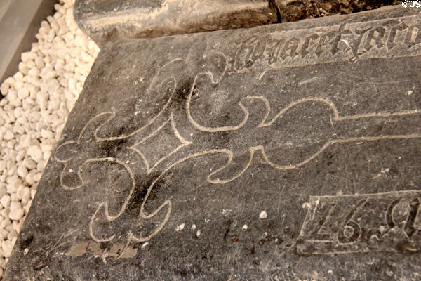 Carved cross on grave slab (1597) at Medieval Mile Museum. Kilkenny, Ireland.