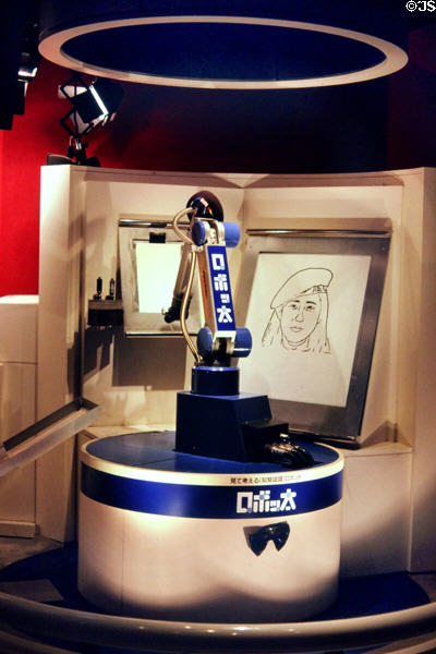 Robot arm drawing a portrait of human at Expo 85. Tsukuba, Japan.