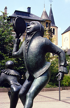 Statue of man with tambourine in city of Luxembourg.