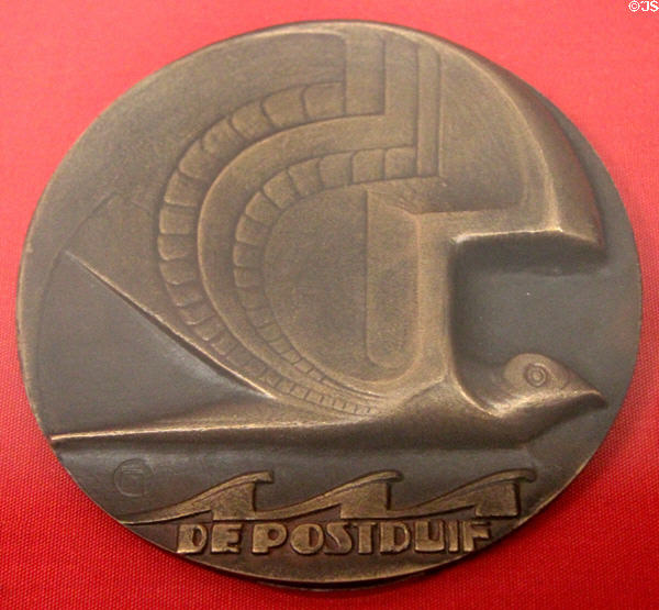 Stylized pigeon over ocean waves medal commemorating first postal flight from the Netherlands to Dutch East Indies (1927) by Van der Hoef at Teylers Museum. Haarlem, Netherlands.
