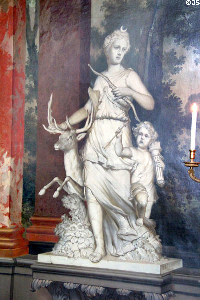 Sculpture of Diana the Huntress holding a bow & accompanied by a deer & Cupid holding arrows in Great Hall. Het Loo, Netherlands.