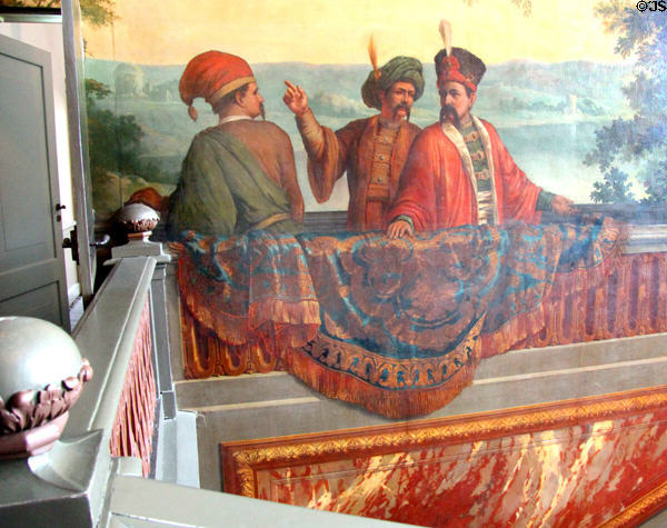 Tromp l'Oeil mural on wall of Grand Staircase depicting richly dressed men, probably Ottoman, by Daniel Marot. Het Loo, Netherlands.