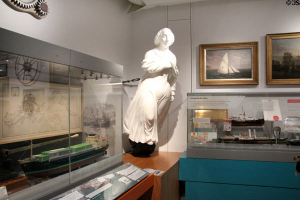 Ship's figurehead among ship models & paintings at M-Shed Museum. Bristol, England.