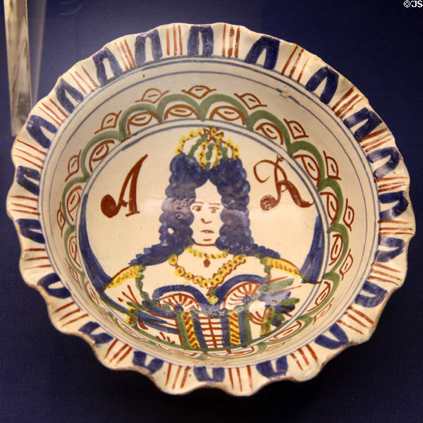 Small ceramic bowl with crinkly rim, called pie-crust (c1702-14) depicting Queen Anne who followed the reign of William & Mary, made in Bristol or likely Brislington, at Bristol Museum & Art Gallery. Bristol, England.