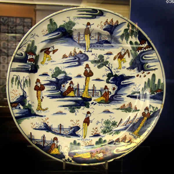 Ceramic dish (1733) decorated to resemble scenes from Chinese pottery, likely made Limekiln Lane Bristol at Bristol Museum & Art Gallery. Bristol, England.