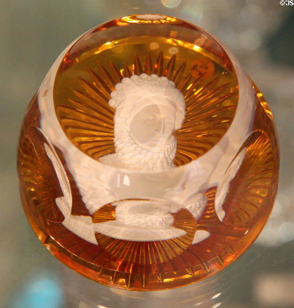 Faceted dome glass paperweight with face at Historical Glass Museum. Redlands, CA.