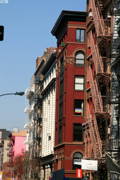 Soho streetscape west along Spring St. from Wooster St. New York, NY.