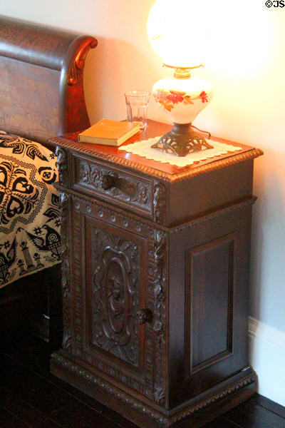 Carved bedside cabinet in Gate Room at Roosevelt's House Sagamore Hill NHS. Cove Neck, NY.