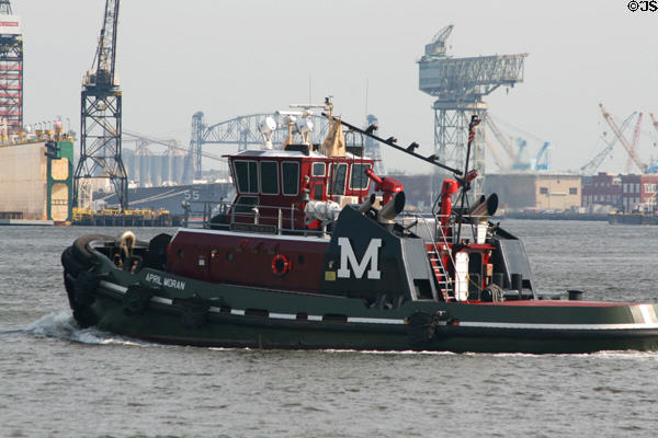 Tug boat crosses Norfolk harbor. Norfolk, VA.