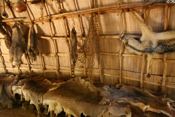 Furs in Native American bark house in Powhatan Village at Jamestown Settlement. Jamestown, VA.
