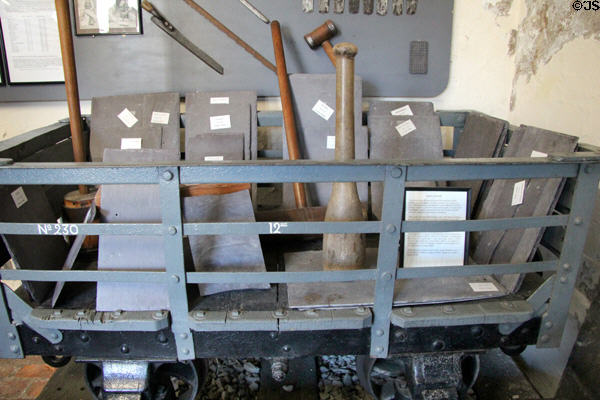 Slate transport car & slate working tools from Penrhyn Quarries at Penrhyn Castle Rail Museum. Bangor, Wales.
