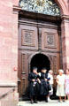 Worshippers in traditional dress leaving Sankt Peter church. Sankt Peter, Germany.