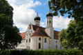 Benediktbeuern Abbey set in the surrounding trees & shrubbery. Germany.