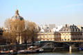Domed Mazarine Library at Institut de France at end of footbridge of Arts over Seine. Paris, France.