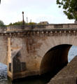 Stone arches of Pont Marie between Île St Louis & right bank. Paris, France.