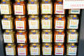 Flavored mustard jars in shop window on Place St Croix. France.