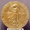 "I hate the cold wind from the East" medal, made in secret, symbolizing Dutch resistance movement during WWII commemorative medal made by Ludwig Wenckebach at Teylers Museum. Haarlem, Netherlands.