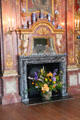 Fire place fronted by large floral arrangement in Old Dining Room. Het Loo, Netherlands.