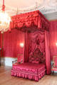 Crimson fabric dyed with cochineal on bed in bedchamber reserved for Queen Mary II. Het Loo, Netherlands.