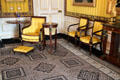 Matching golden yellow chairs, foot stool & wall covering in office of King Willem I. Het Loo, Netherlands.