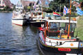 Boats moored along the canal. Sloten, Netherlands.