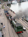 Steam locomotive taking passengers along Floating Harbour. Bristol, England.