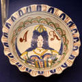 Small ceramic bowl with crinkly rim, called pie-crust depicting Queen Anne who followed the reign of William & Mary, made in Bristol or likely Brislington, at Bristol Museum & Art Gallery. Bristol, England.