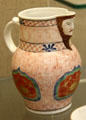 Ceramic jug with moulded mask lip at Bristol Museum & Art Gallery. Bristol, England.