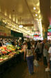 Shoppers in Main Arcade of Pike Place Market. Seattle, WA.